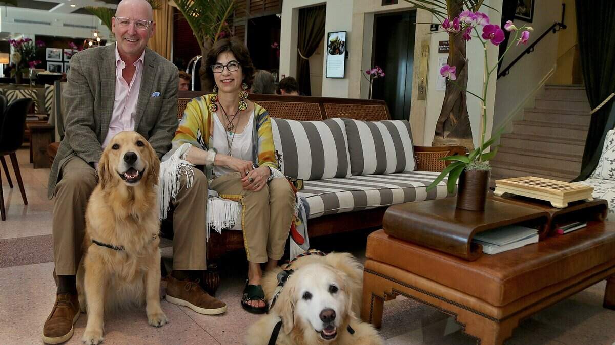FILE 2019: hotel owners Jonathan Plutznik Lesley Goldwasserin posed with their dogs Betsy (left) and Kate in the lobby of their hotel where they have created an art salon in with regular exhibitions, talks and meetings, in Miami Beach on Thursday August 15, 2019.